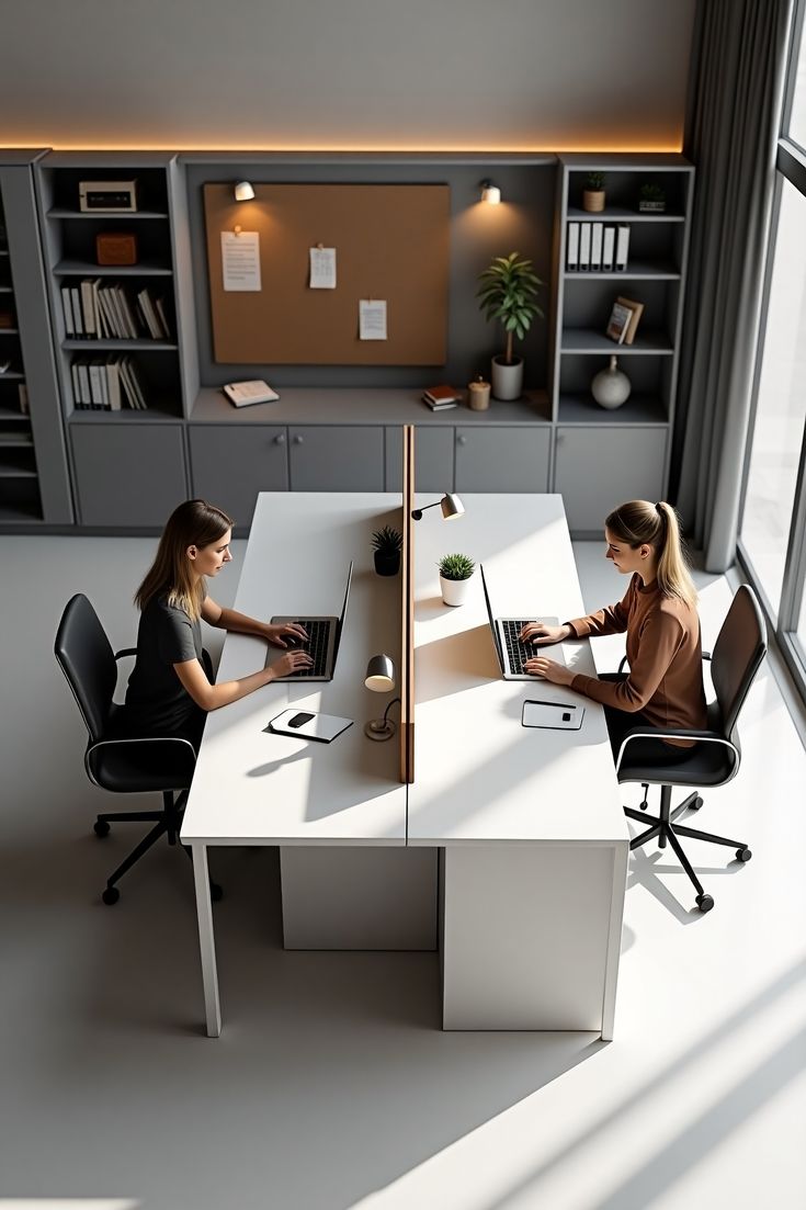Two people reviewing a desk layout sketch during a workspace consultation
